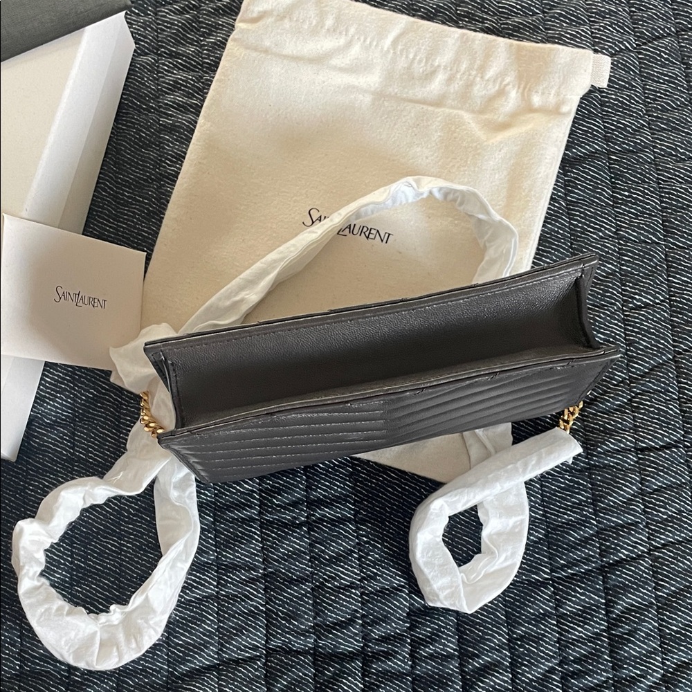Saint Laurent
Cassandre Envelope Chain Wallet in Lambskin - Picture 10 of 12